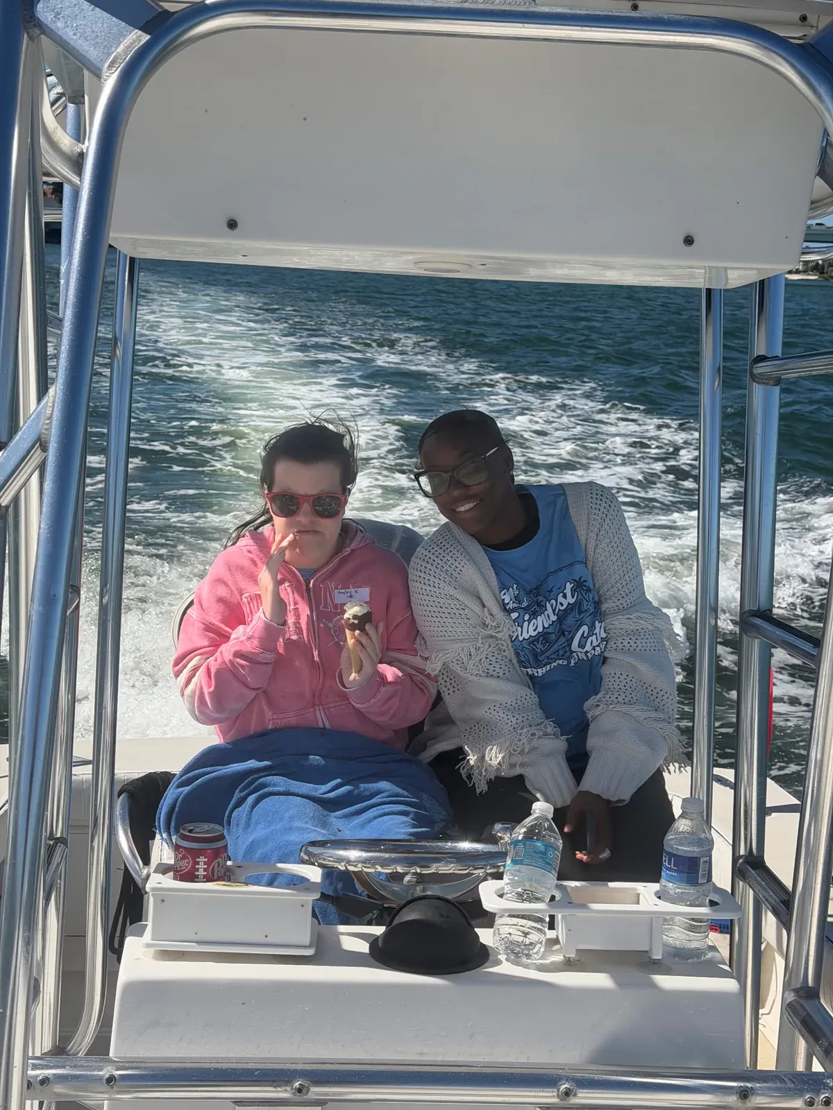 Two guests enjoying the ride aboard the boat — Friendliest Catch, October 20, 2026.