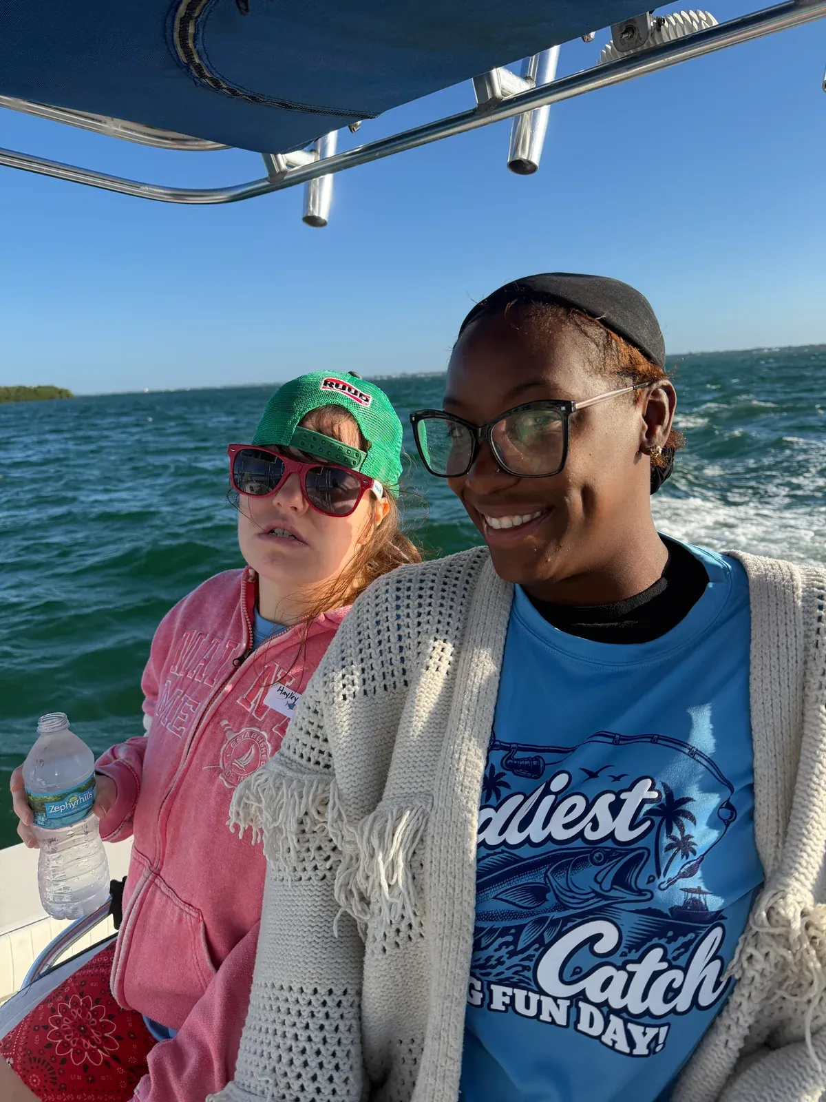 Two event participants enjoying time on the boat — Friendliest Catch, October 20, 2026.