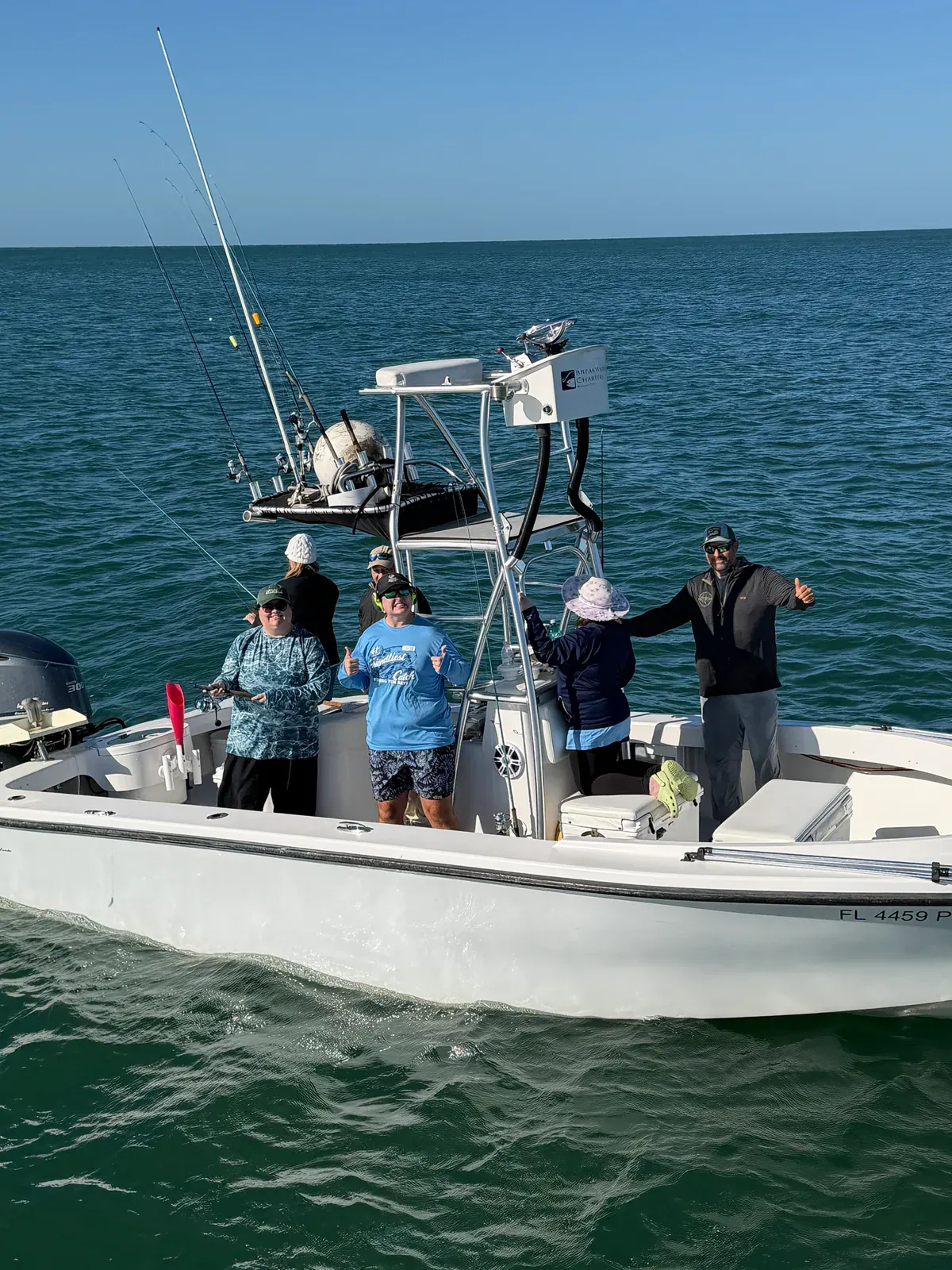 Anglers and volunteers together aboard a boat during Friendliest Catch Fishing Fun Day — Sarasota Bay, October 20, 2026.