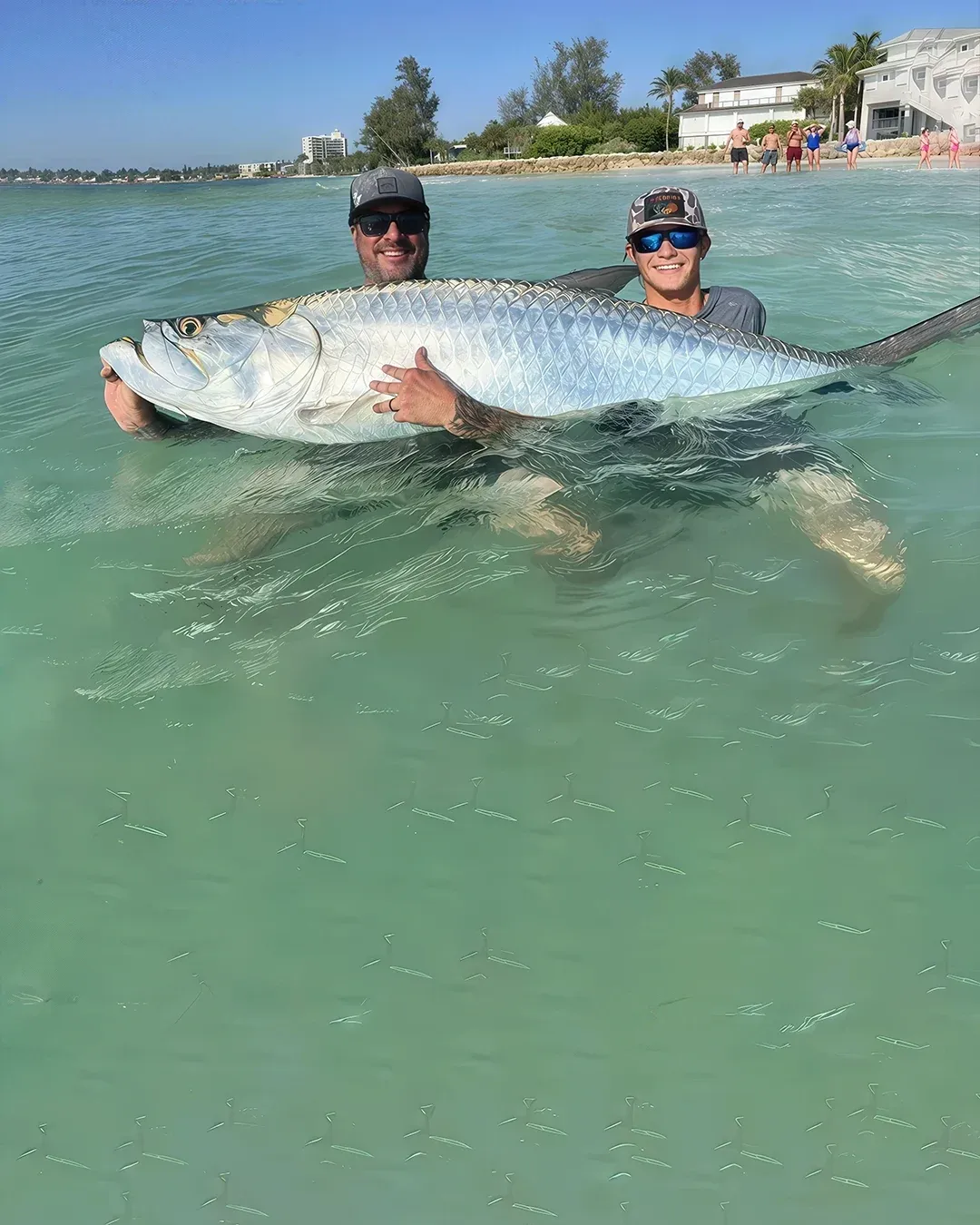 Anglers on a Sarasota tarpon fishing charter.