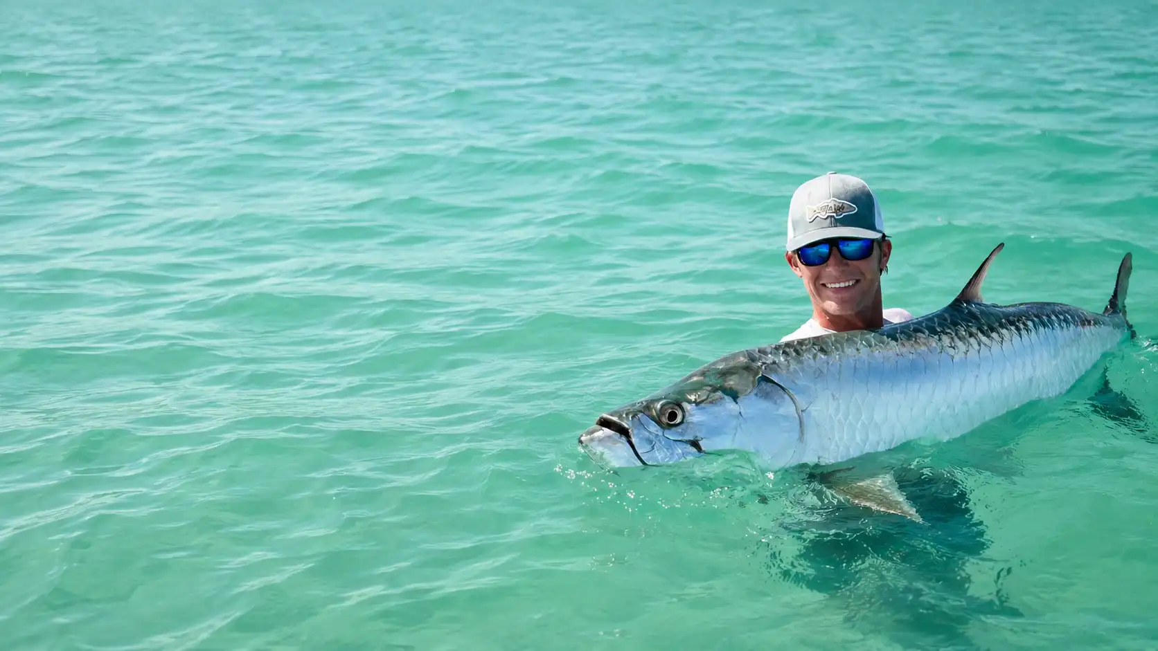 Angler with a large tarpon during a late-season tarpon fishing trip in Southwest Florida